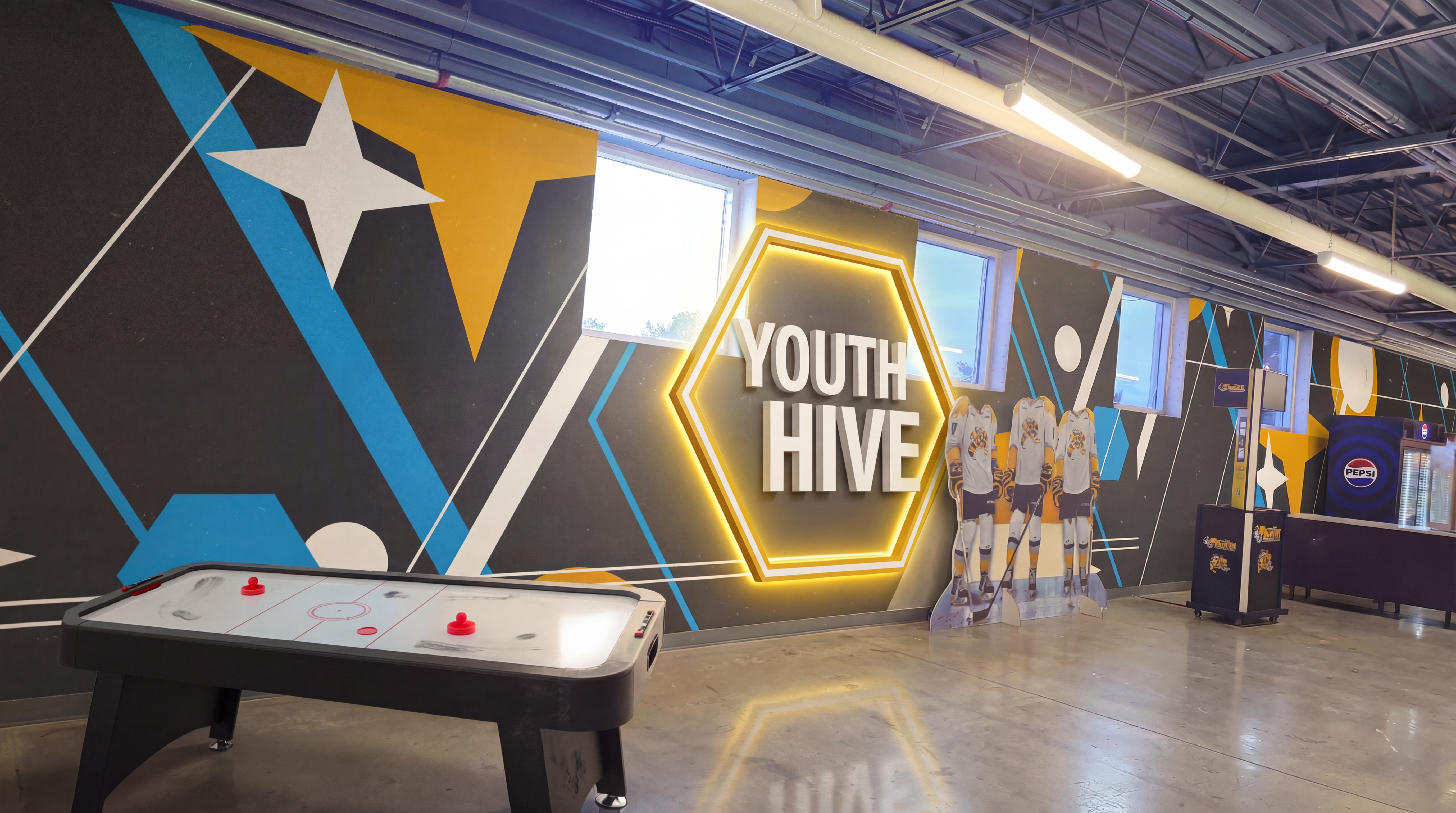 Youth Hive kids zone with playful colors and hexagonal brand elements